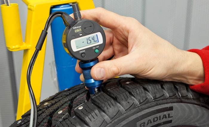 замер выступа шипов для зимней шины